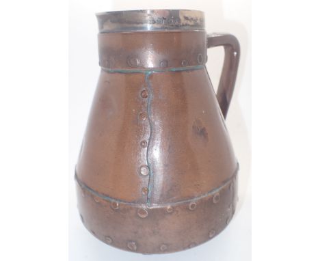 Royal Doulton Lambeth Silicon ceramic jug in the form of a leather flagon with hallmarked silver rim assay London 1883 H: 18 