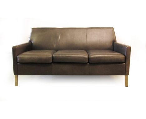 A black three seater reception-type sofa on aluminium feet