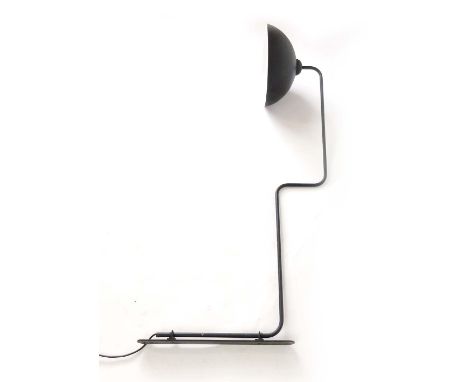 A 1950's black metal wall light, the cantilever arm supporting a matching shade and a matching spare shade  CONDITION REPORT: