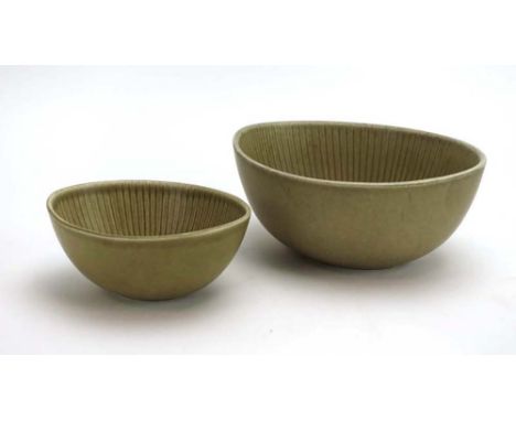 Gunnar Nylund for Rorstrand Ritzi, a graduated pair of pale green bowls, max. w. 17 cm