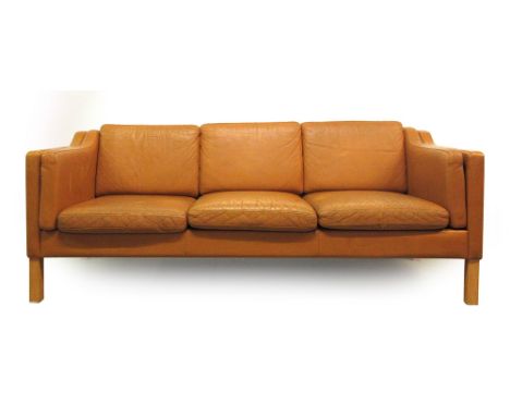 A 1970's tan leather three seater sofa on beech legs, in the manner of Borge Mogensen CONDITION REPORT: Depth 75 cm. Length 1