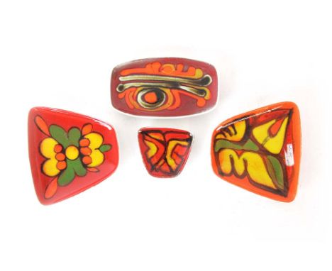 A group of four Poole 'Delphis' Range dishes brightly decorated on red grounds