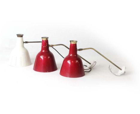 A pair of 1950's red enamelled and pierce work wall lights on brass arms with white enamelled mounts, possibly French, togeth