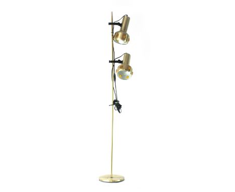 A 1970's brass coloured standard lamp with two adjustable spots CONDITION REPORT: Working order unknown, lead cut. Some wear.