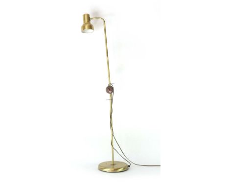 A 1970's brass coloured standard lamp with an adjustable shade CONDITION REPORT: Working order unknown, lead cut. Some wear. 