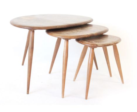 Lucian Ercolani for Ercol, a nest of three elm and beech 'Pebble' occasional tables, max. w. 64 cm