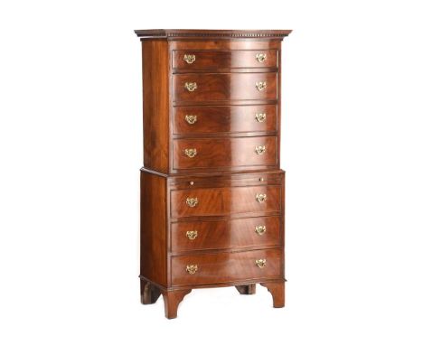 SERPENTINE FRONT CHEST ON CHEST FITTED WITH SEVEN DRAWERS WITH BRUSH SLIDE AND BRASS DROP HANDLES.RAISED ON BRACKET FEET.HEIG