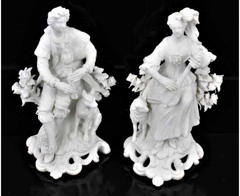 A pair of Derby bisque figures of a shepherd and shepherdess, late 18th/early 19th century, shown seated on scrolled rococo b