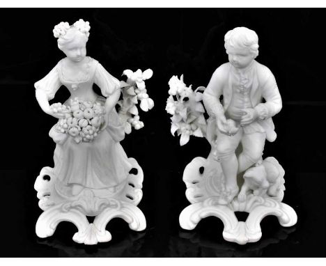 A pair of Derby bisque figures of a boy and a girl, late 18th/early 19th century, shown seated on scrolled rococo bases, the 