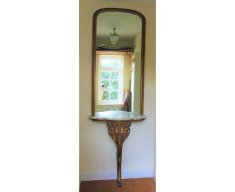 Late 19th/early 20th century gilt painted console table with shaped marble top on carved and scroll support, with arched gilt