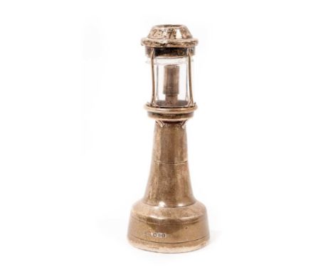 Edwardian silver novelty cigar lighter, in the form of a lighthouse, Chester 1909, 15cm high.Provenance: By descent from Doug