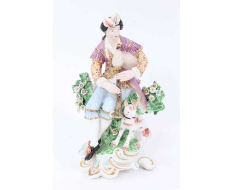 Derby figure of a shepherd playing a pipe with dog at feet on rococo base, circa 1815-20, 17 cm highChips to bocage otherwise