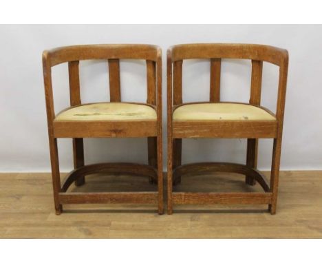 Pair 1920s limed oak tub chairs, with slip in seats. Provenance: By descent from Douglas Shepherd (1922-1989), a designer and