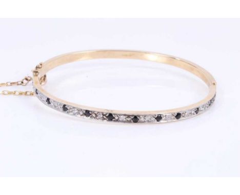 Sapphire and diamond hinged bangle in 9ct yellow gold setting.22.01 grams