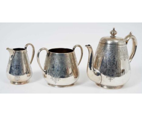 Victorian silver three piece teaset comprising teapot of tapered cylindrical form with overall engraved foliate and scroll de