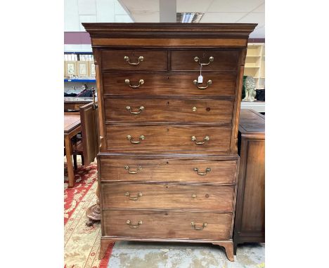 George III mahogany and inlaid chest on chest, the upper section with concave cornice and two short over three long graduated