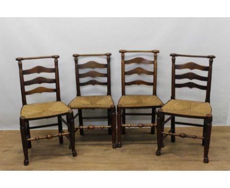 Set of four 19th century ash and elm country chairs, each with ladder back and rush seat on turned legs and pad feet