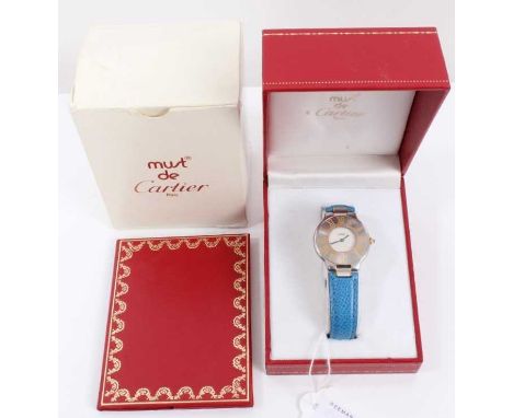 Must de Cartier wristwatch with circular white enamel dial and stainless steel bezel with gold Roman numerals on blue leather