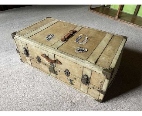 1920s velum cabin trunk with original fitted drawers enclosed by a tambour shutter, hanging rail and applied presentation ins