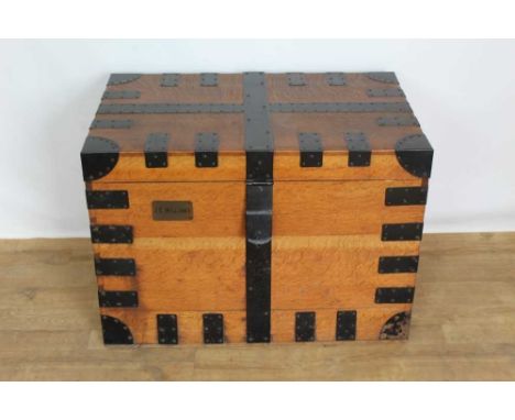 Early 20th century teak and metal bound silver trunk retailed by Harrods, with baize and marbled paper lined interior and fit