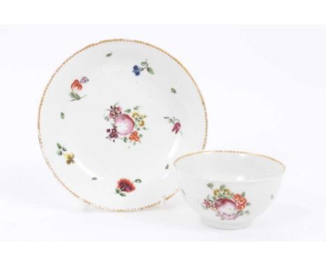 A Bristol tea bowl and saucer, circa 1775, polychrome painted with flowers and fruits, gilt borders, the saucer measuring 12.