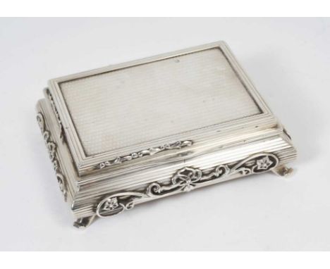 Unusual George V silver table tobacco box in the form of a Chinese low table with engine turned decoration and applied scroll