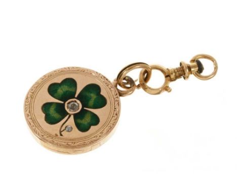 Antique gold enamel and diamond 'lucky' locket with a green guilloché enamel lucky four-leaf clover to the front, centred wit