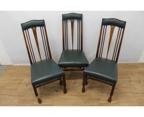 Three Arts &amp; Crafts oak and pewter inlaid dining chairs in the manner of Charles Rennie Macintosh, each with stud closed 