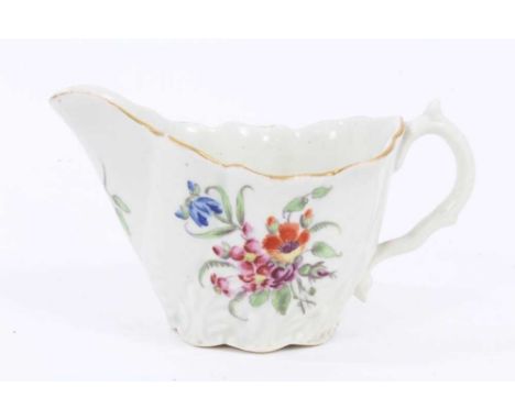 A Worcester cream jug, circa 1760, of Low Chelsea Ewer form, polychrome painted with floral sprays, 6.5cm highA nick to the b