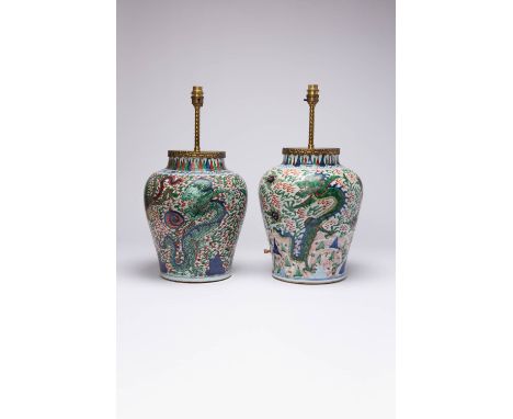 TWO CHINESE WUCAI 'DRAGON' AND 'DRAGON AND PHOENIX' JARS 17TH CENTURY Each painted with two pairs of dragons confronting flam