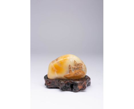 A CHINESE SOAPSTONE BOULDER CARVING LATE QING DYNASTY Carved with a figure with his attendant in a cart, all picked out in oc