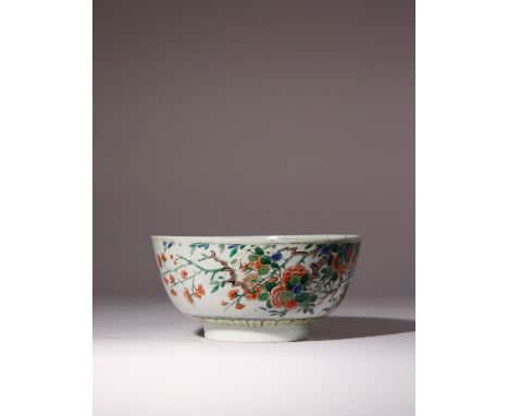 A CHINESE FAMILLE VERTE 'PRUNUS' BOWL KANGXI 1662-1722 The exterior painted with leafy flowering branches, the interior decor