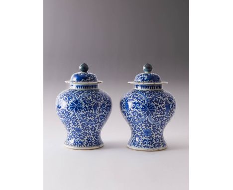 A PAIR OF CHINESE BLUE AND WHITE BALUSTER VASES AND COVERS 19TH CENTURY Each painted with stylised lotus and leaping carp ami