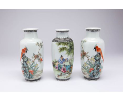 THREE CHINESE PORCELAIN VASES 20TH CENTURY Comprising: a pair each with birds perched on rocks, the third with figures making