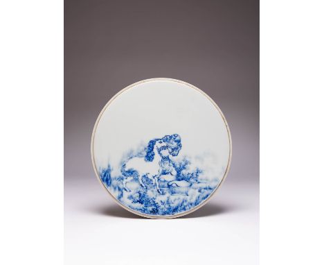 A CHINESE BLUE AND WHITE CIRCULAR PLAQUE AFTER WANG BU MODERN Painted with a horse and groom and with two baskets, with a sma