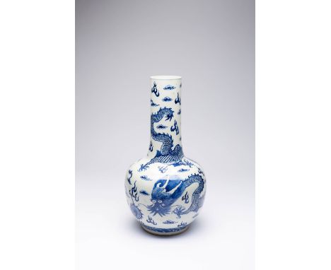 A CHINESE BLUE AND WHITE 'DRAGON' BOTTLE VASE 19TH CENTURY Painted with two scaly five-clawed dragons pursuing a flaming pear