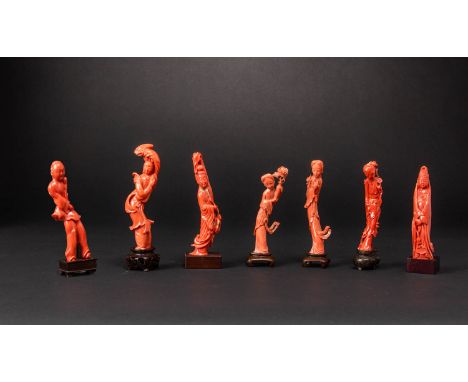 SEVEN CHINESE CORAL CARVINGS OF FEMALE DEITIES AND A BOY QING DYNASTY Each carved as a slender figure, the goddesses include 