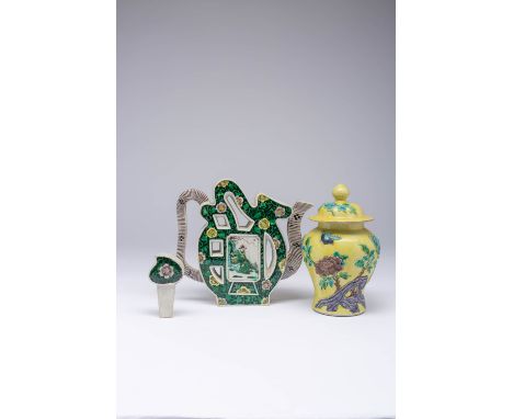 A CHINESE FAMILLE NOIRE SHOU-SHAPED EWER AND COVER LATE QING DYNASTY The body painted with two panels of figures, the base wi