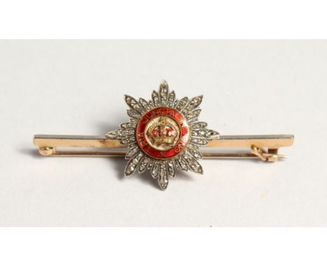 A DIAMOND AND ENAMEL BAR BROOCH 'TRIA JUNTCA UNO'.