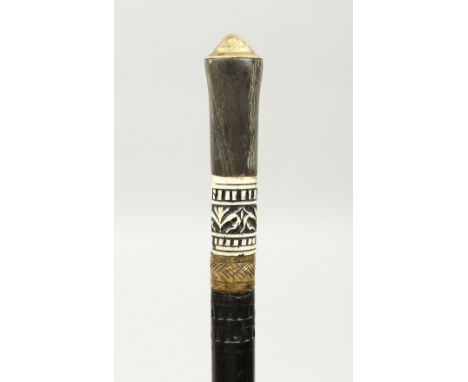 AN EBONY SWORD STICK with bone inlay. 36ins long.