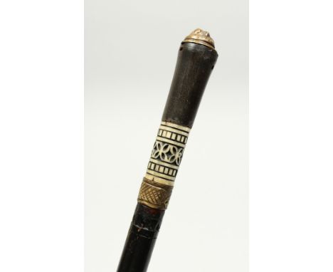 AN INDIAN BONE INLAID SWORD STICK. 23ins long.