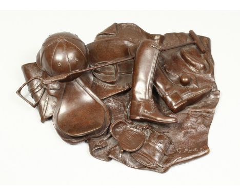 G.P.K. A BRONZE GROUP- HAT, BOOTS, POLO STICK ETC., monogrammed G.P.K. 86. 12ins across.