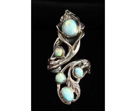 AN ART NOUVEAU DESIGN SILVER AND RED OPAL RING