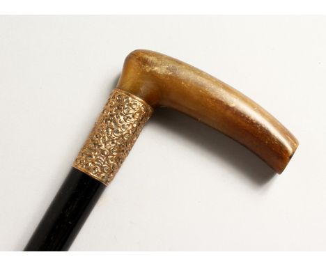 A RHINO HANDLE WALKING STICK with tablet dated May 1905. 33ins long.