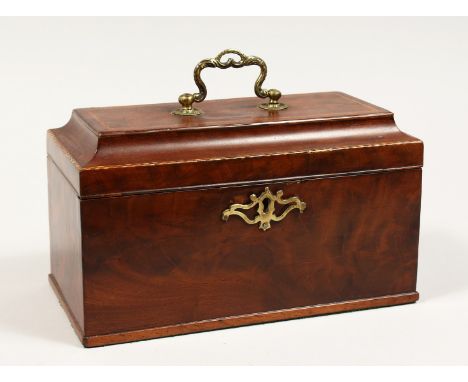 A GEORGE III MAHOGANY THREE DIVISION CADDY  with banded top, brass carrying handle and escutcheon. 10ins long.