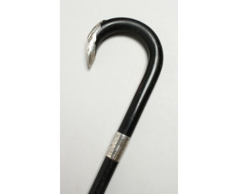 AN EBONY SILVER MOUNTED WALKING STICK, LONDON 1933. 36ins long.