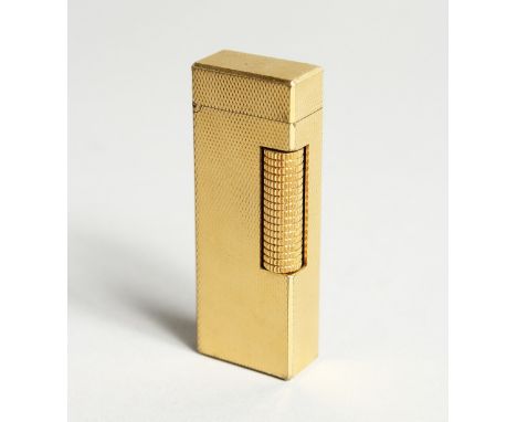 A DUNHILL GILT METAL GAS LIGHTER 2.5ins long