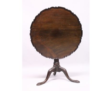 A CHIPPENDALE STYLE MAHOGANY TILT TOP TRIPOD TABLE with pie crust top, gun barrel support, curving legs with claw feet. 2ft 9