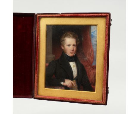 AN EARLY VICTORIAN PORTRAIT MINIATURE OF A YOUNG MAN, in a folding leather case. 4ins x 3ins.