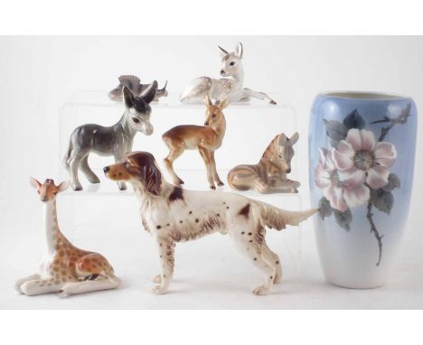 Royal Copenhagen vase, a B&G perch, Royal Dux faun, Goebel setter, and three Russian animal models and a one other. Unfortuna